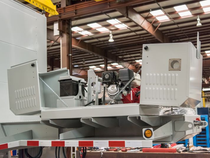 Small air compressor enclosure mounted on a trailer