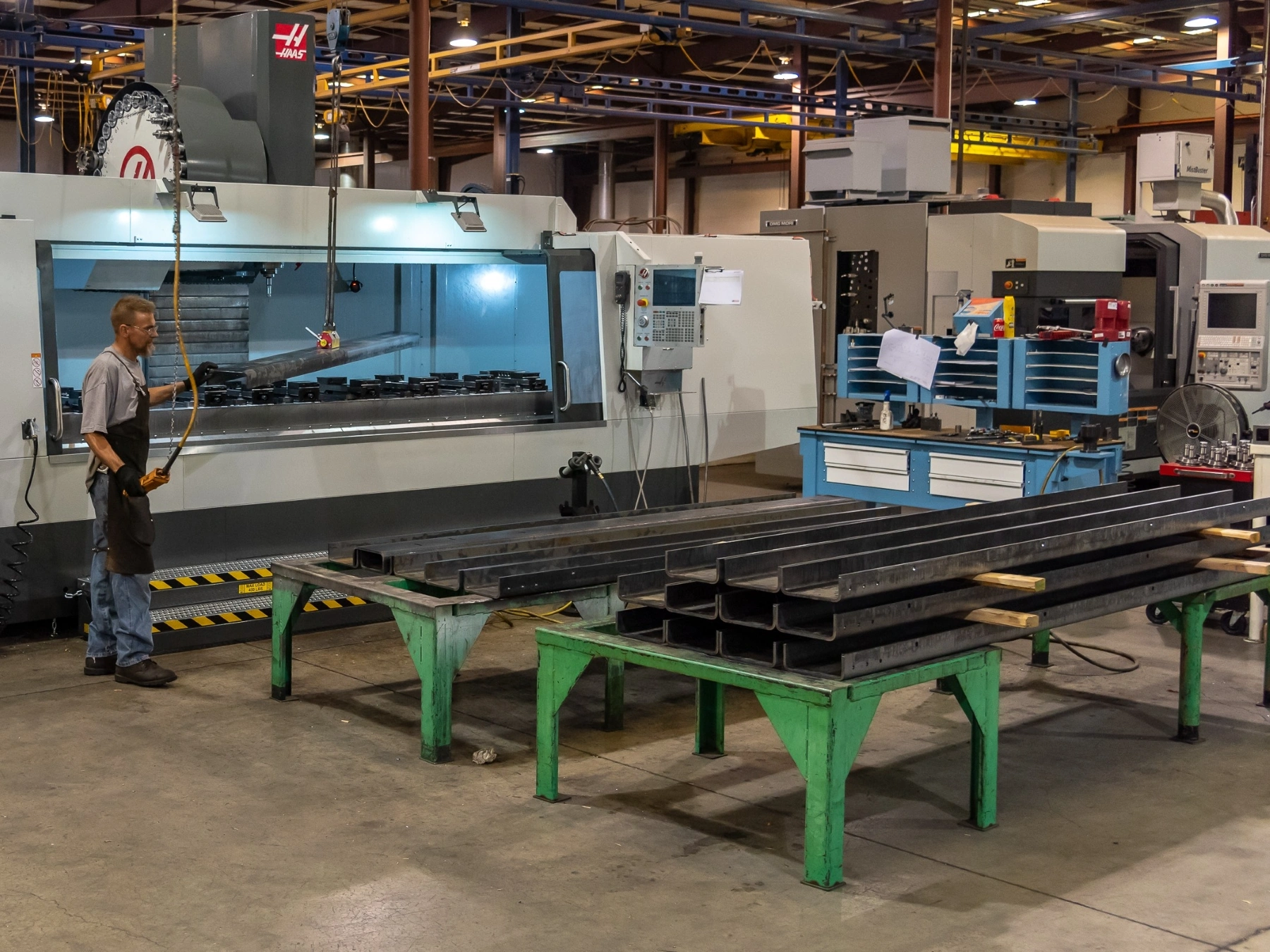 Machining long channels of formed metal plate