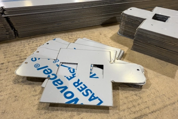 A stack of small parts cut out of thin-gauge stainless steel