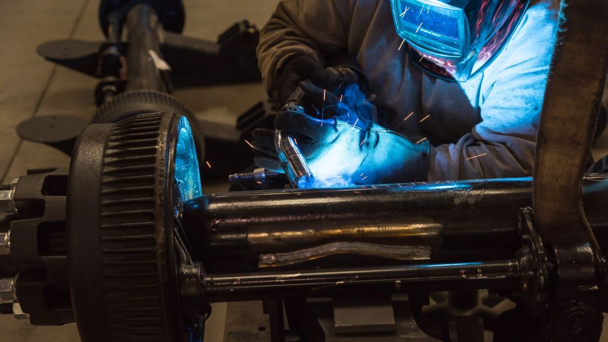 Up close look at weld fume extraction while welding a trailer axle