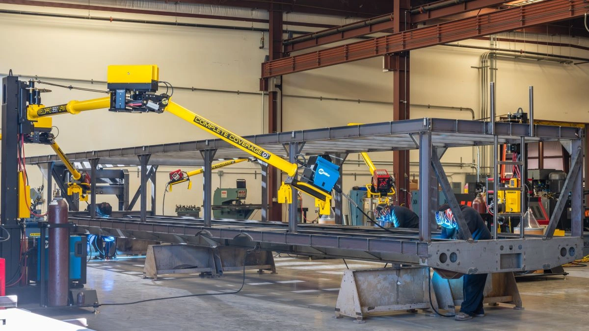 A large trailer weldment being welded using WeldPro 360 LRW-18 MIG Welding Boom Arms