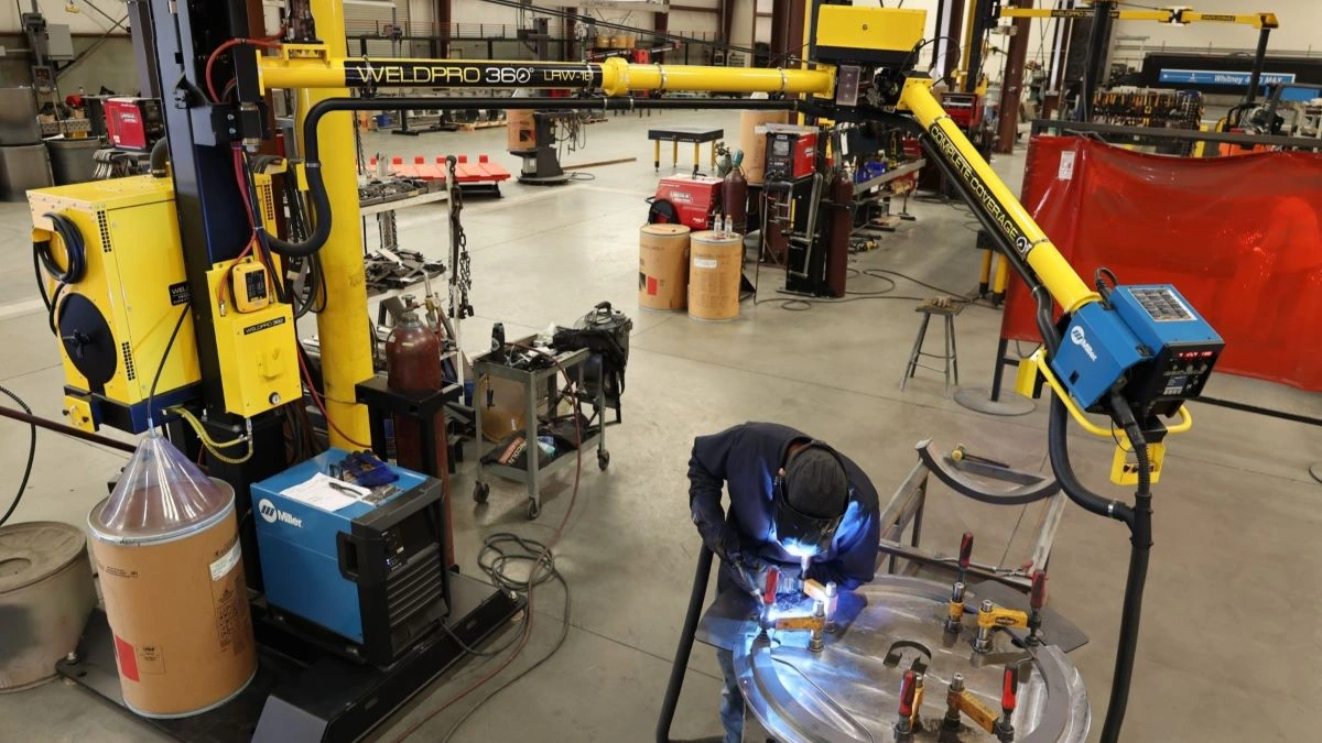 A small weldment being tack welded using a WeldPro 360 LRW-18 MIG Welding Boom Arm